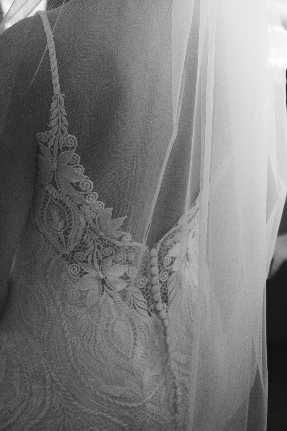 Close-up of intricate beadwork and embroidery on a luxurious wedding gown